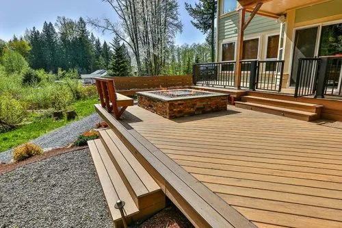 Deck with built-in bench seating and wide steps in Mount Vernon, WA