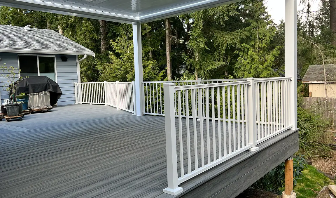 Covered composite deck with white vinyl railing in Mount Vernon, WA